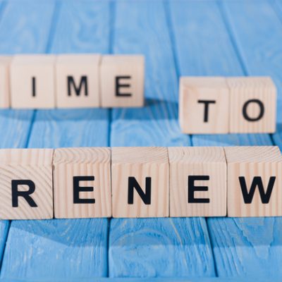 stock-photo-close-view-arranged-wooden-blocks-time-renew-phrase-blue-wooden